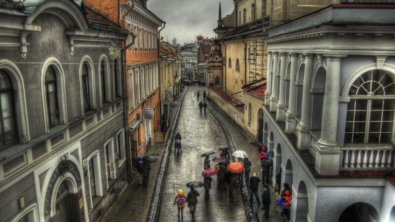 People with Umbrellas on Street