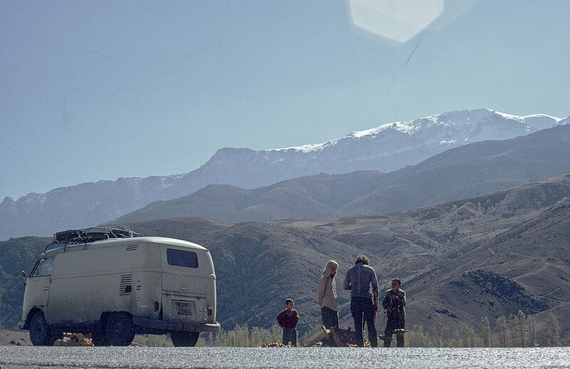 People with Van in Mountains