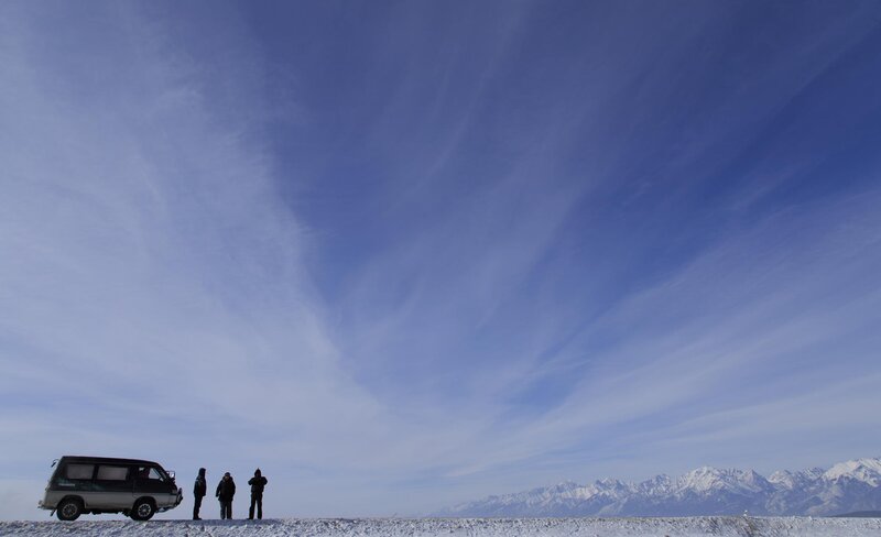 People with Van in Snow
