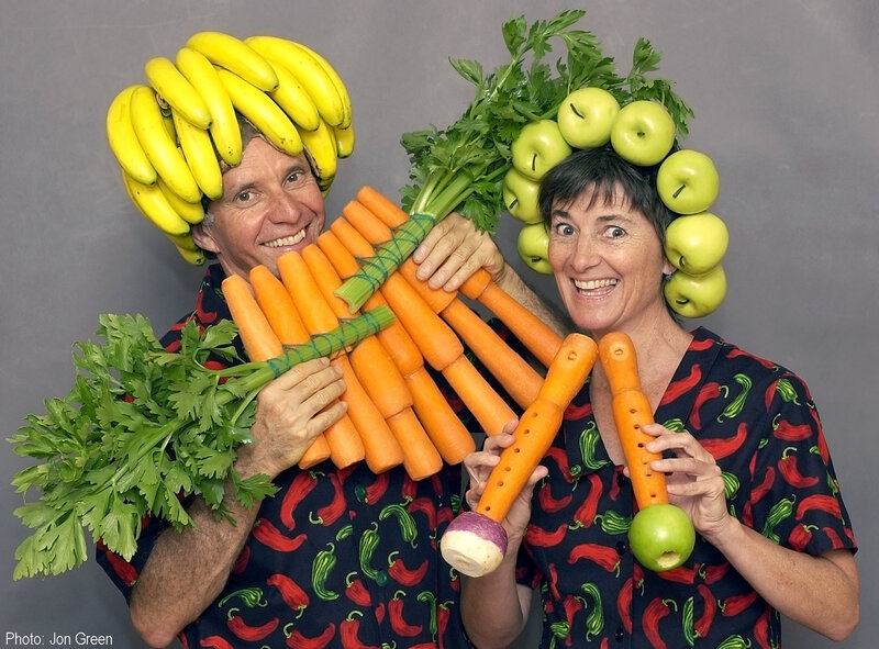 People with vegetable instruments