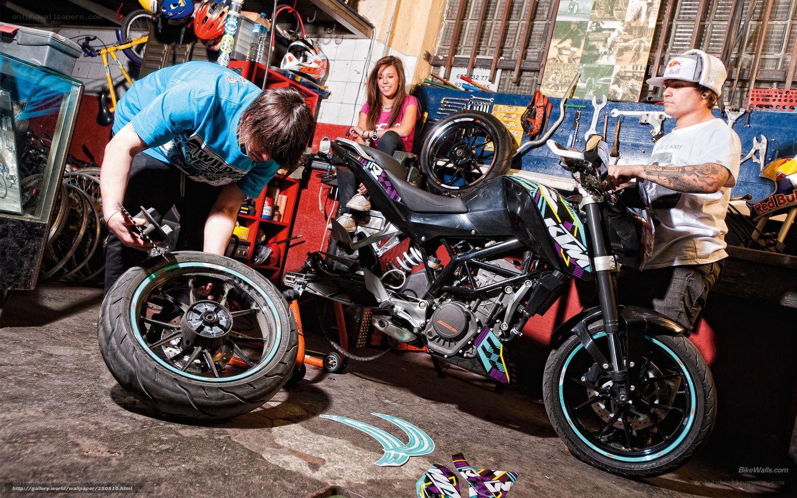 People working on a motorcycle