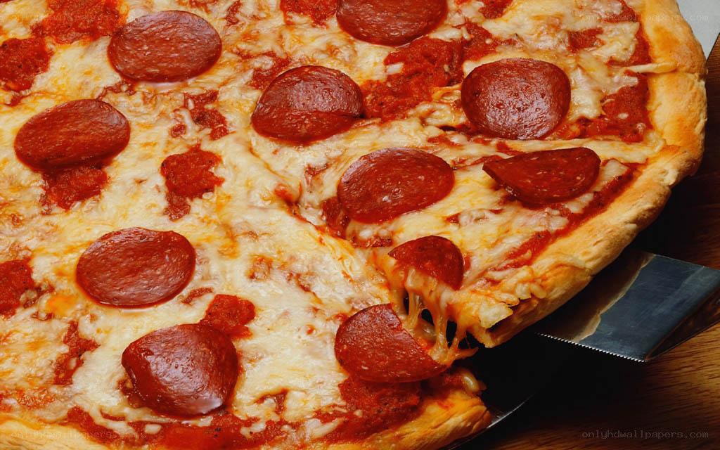 Pepperoni pizza on wooden board