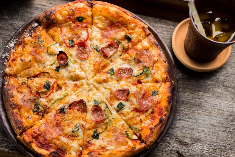 Pepperoni pizza on wooden table