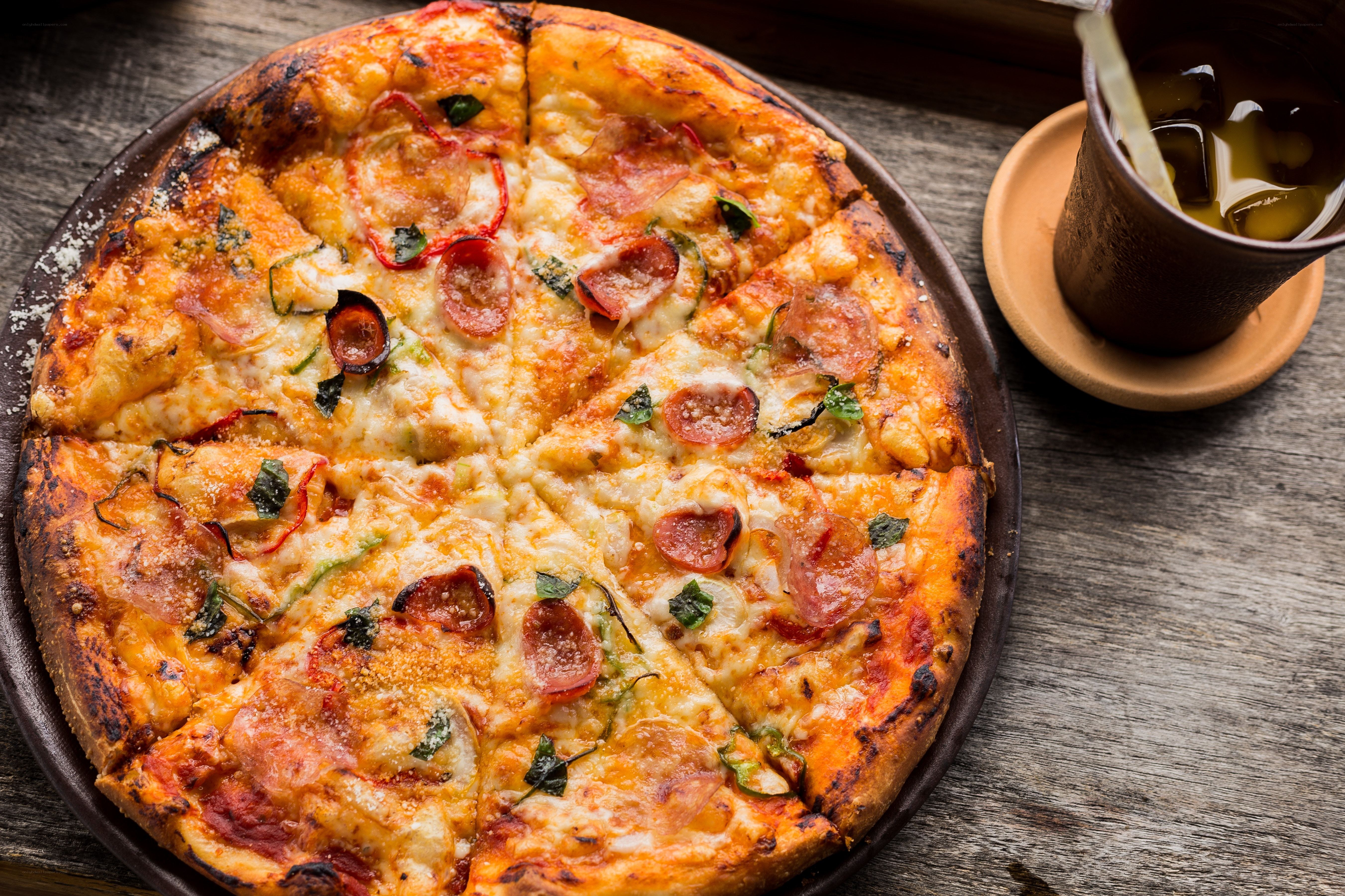 Pepperoni pizza on wooden table