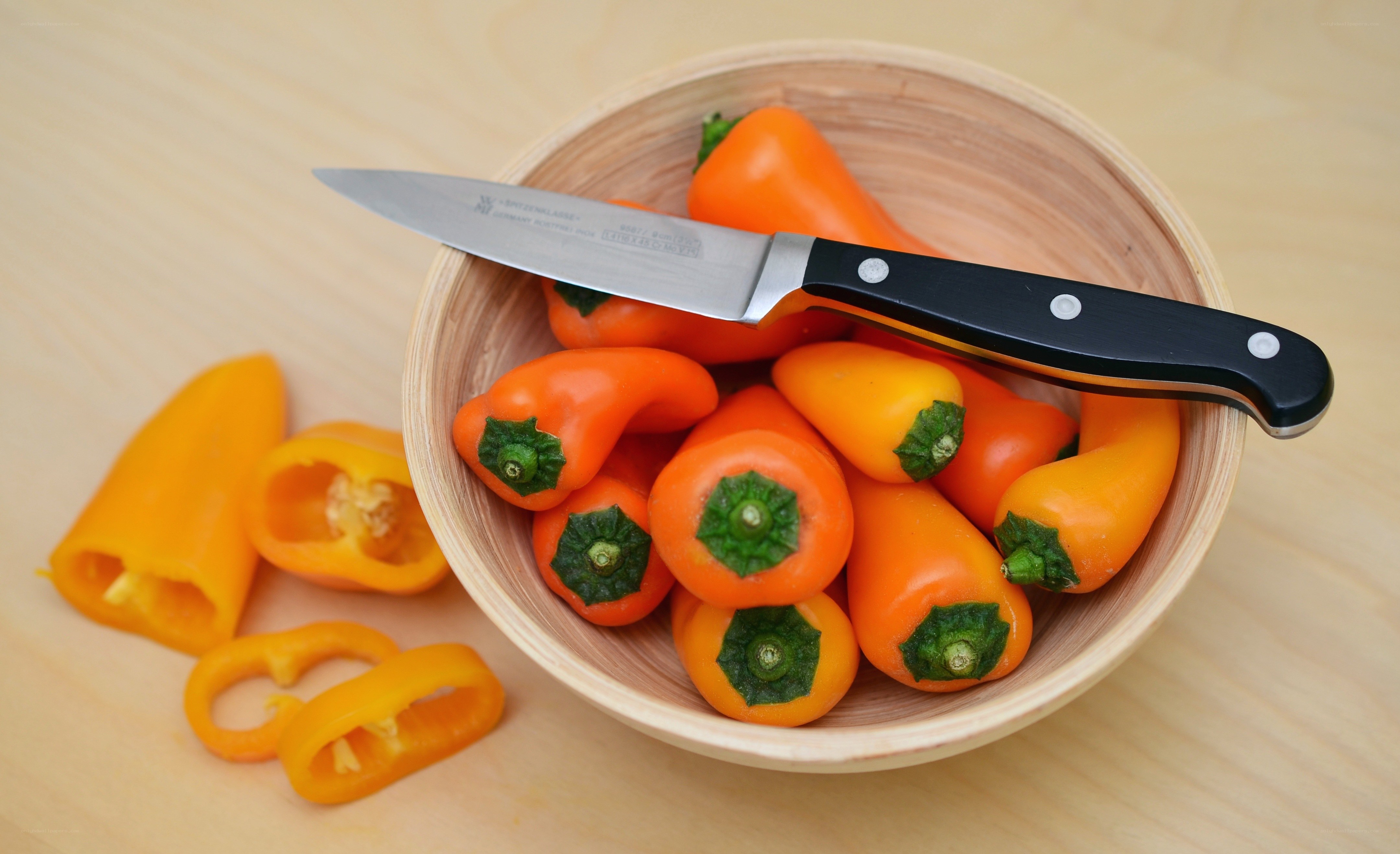Peppers in a wooden bowl