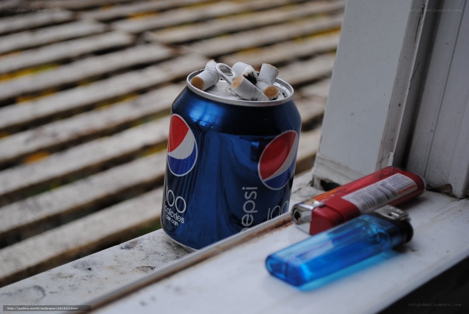 Pepsi can with cigarette butts
