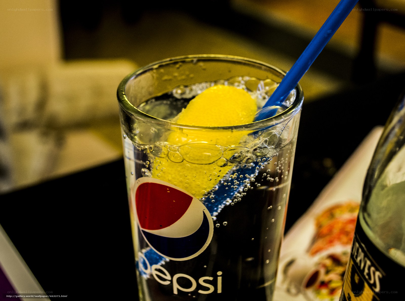 Pepsi with lemon and straw