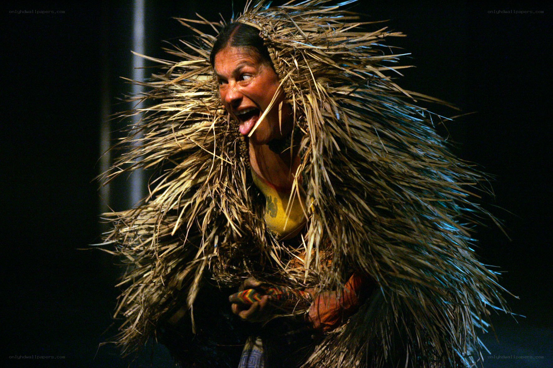performer in straw costume