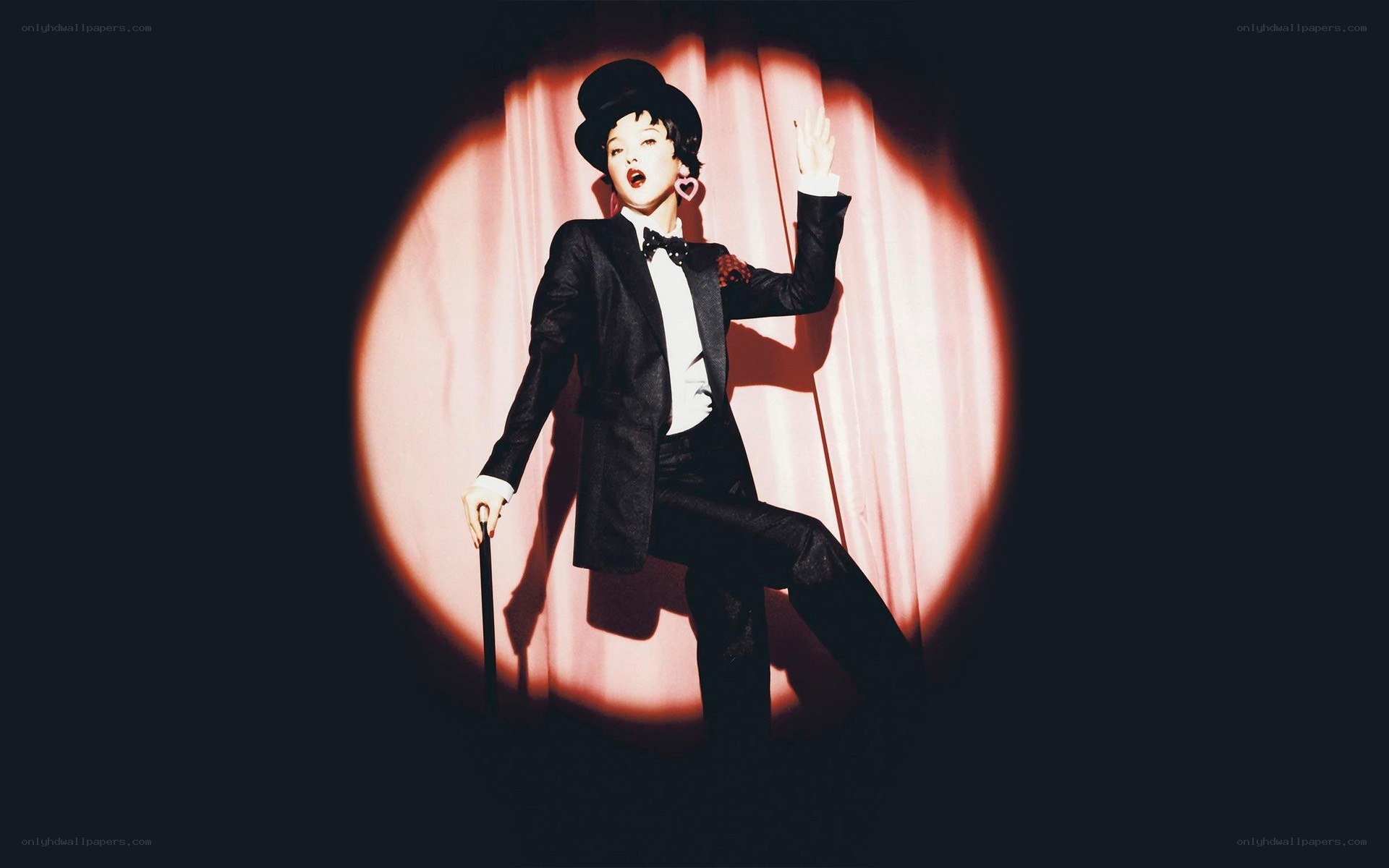 performer in tuxedo on stage