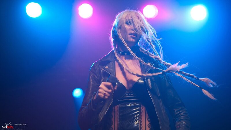 performer on stage with braids