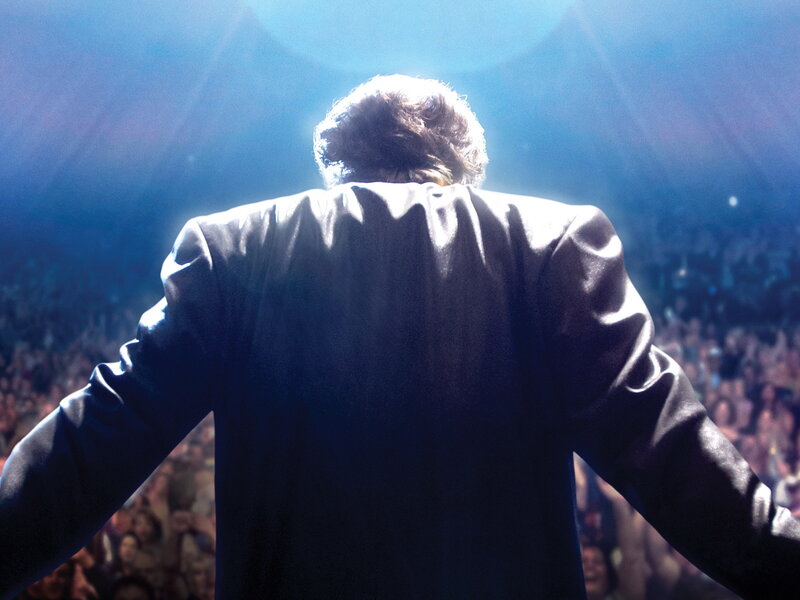 performer on stage with crowd