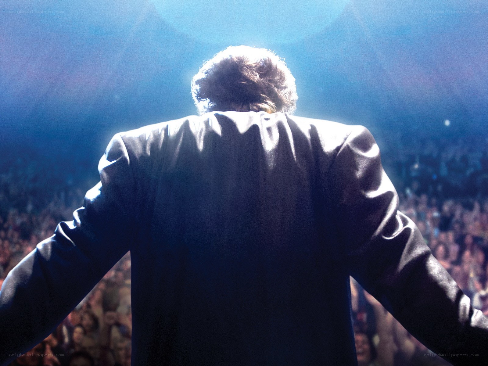 performer on stage with crowd
