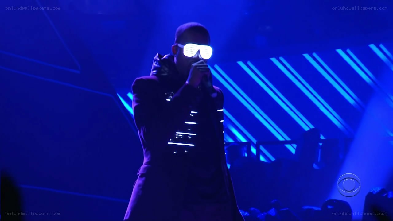 performer on stage with lights