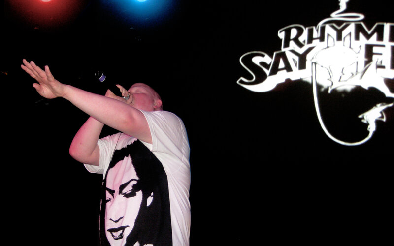 performer on stage with microphone