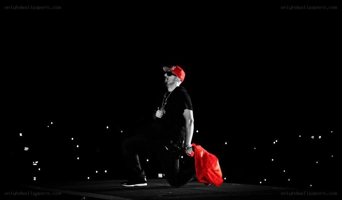 performer on stage with red hat