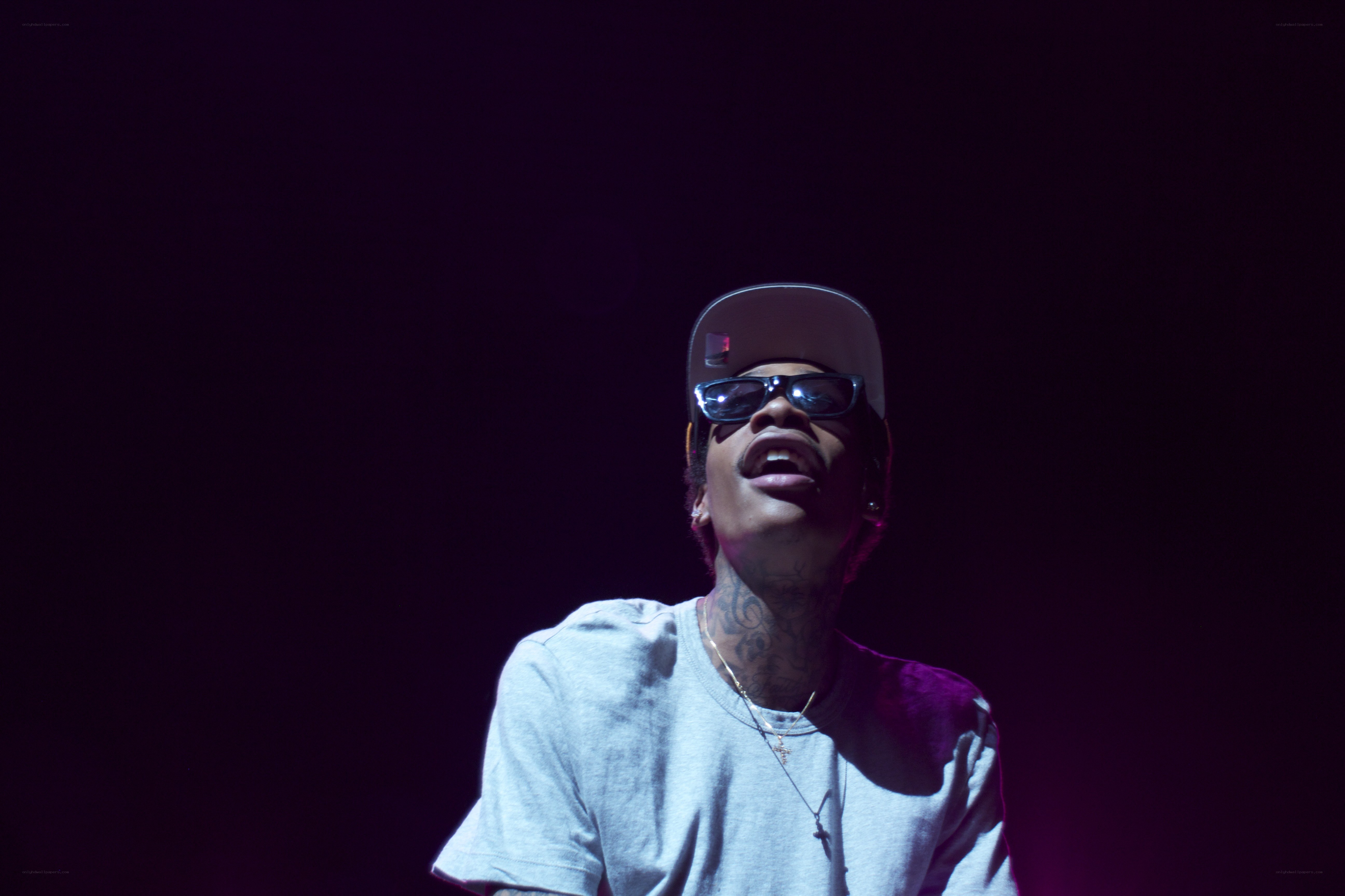 performer on stage with sunglasses