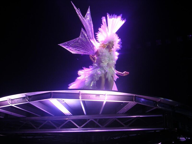 performer with feathered wings