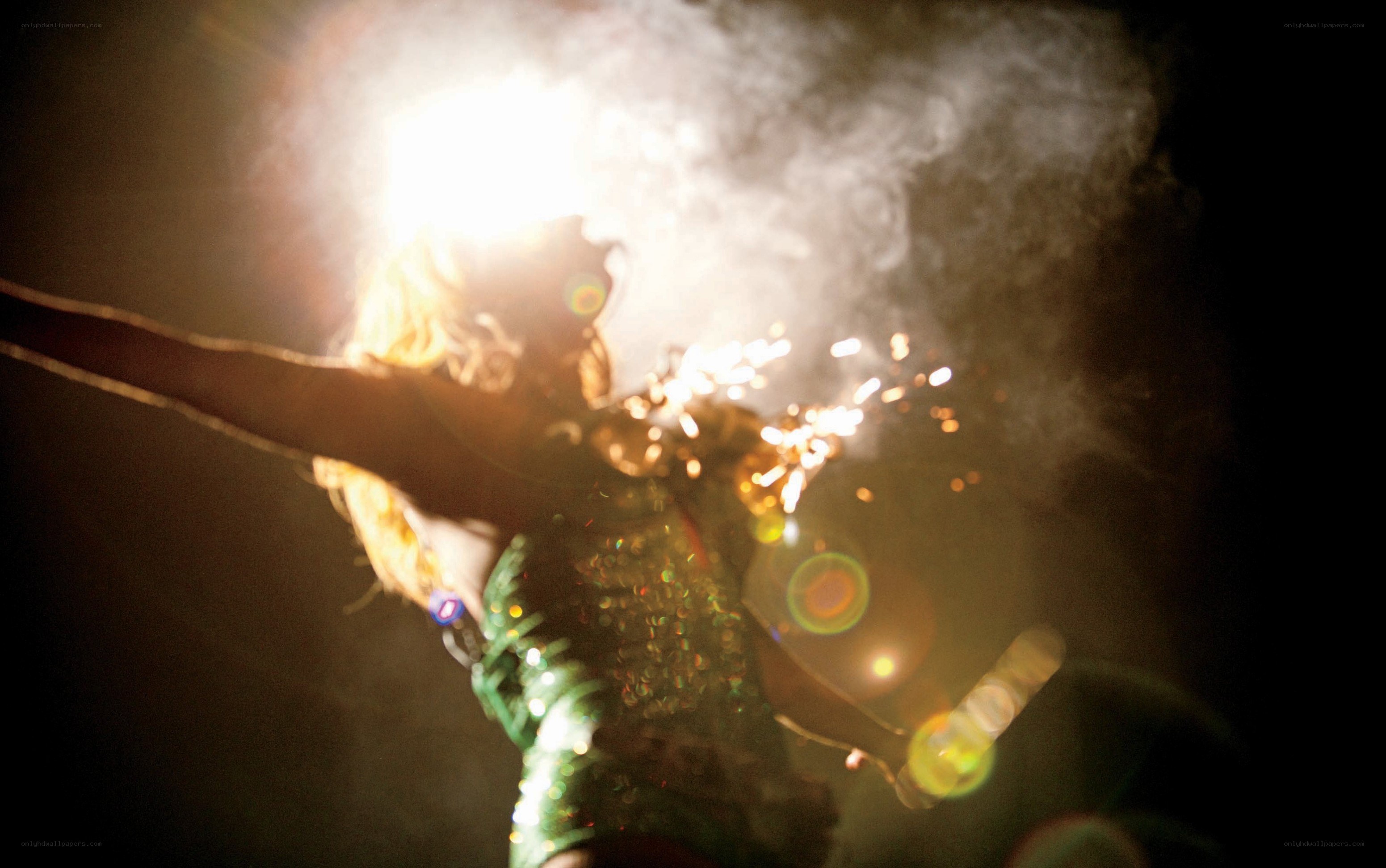 performer with sparklers on stage