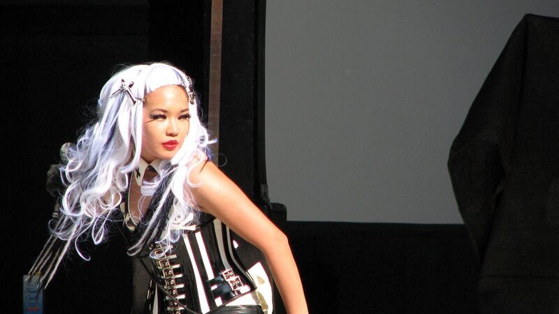 performer with white hair on stage