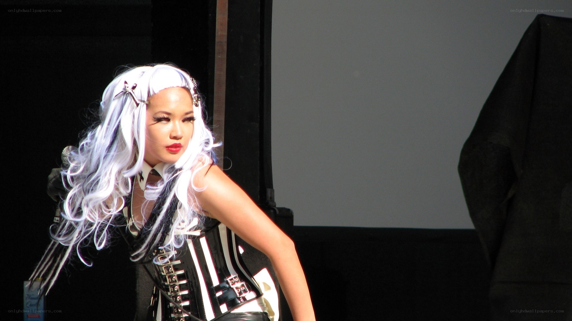 performer with white hair on stage