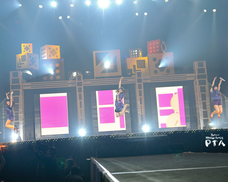 Performers jumping on stage