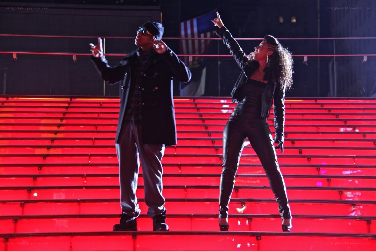 Performers on a red-lit stage