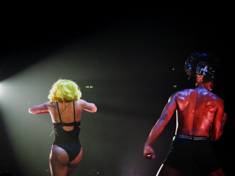 Performers on stage from behind