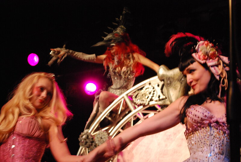 Performers on stage in costumes