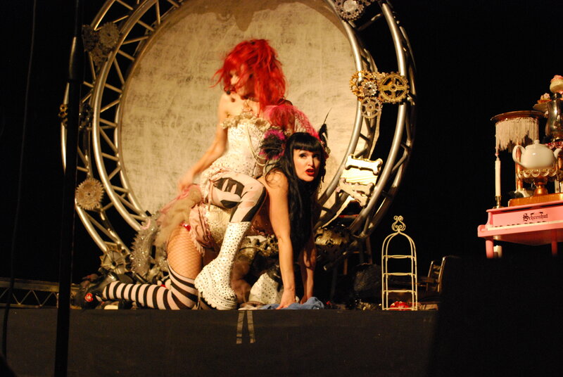 Performers on stage with red hair