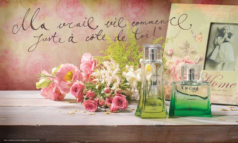 Perfume and flowers on table