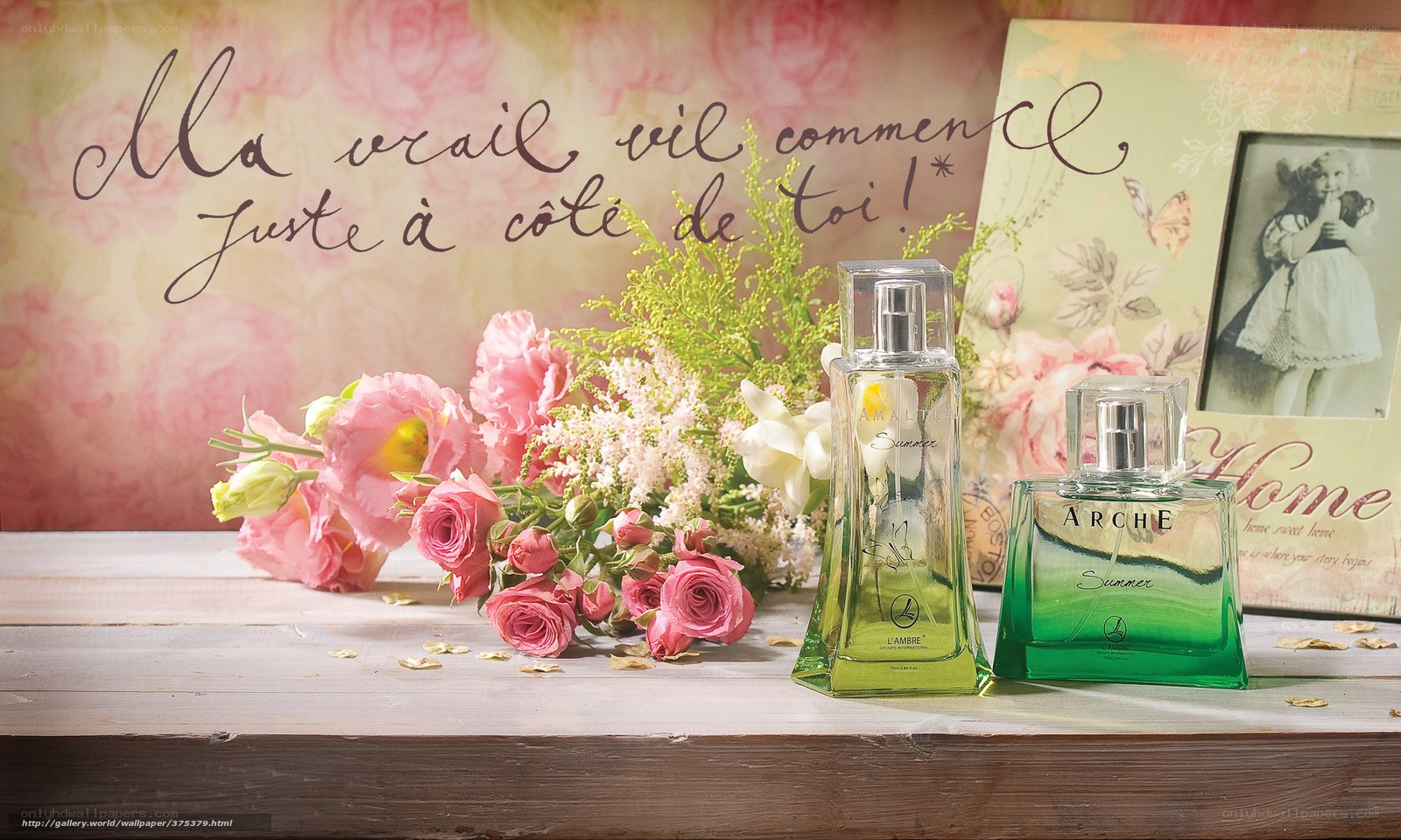 Perfume and flowers on table