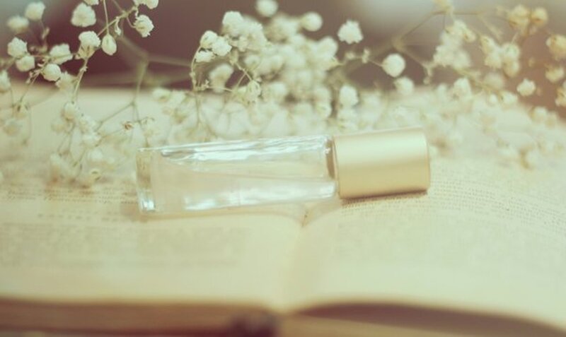 Perfume Bottle on Book — White