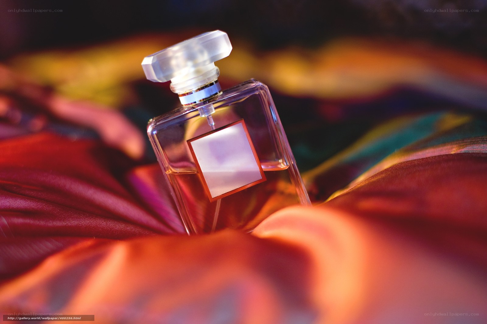 Perfume bottle on fabric