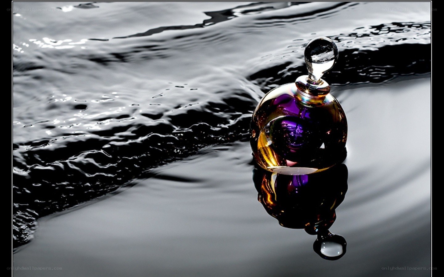Perfume bottle on water