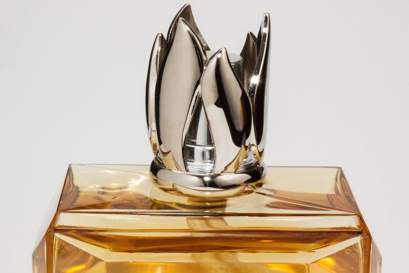 Perfume bottle with silver cap