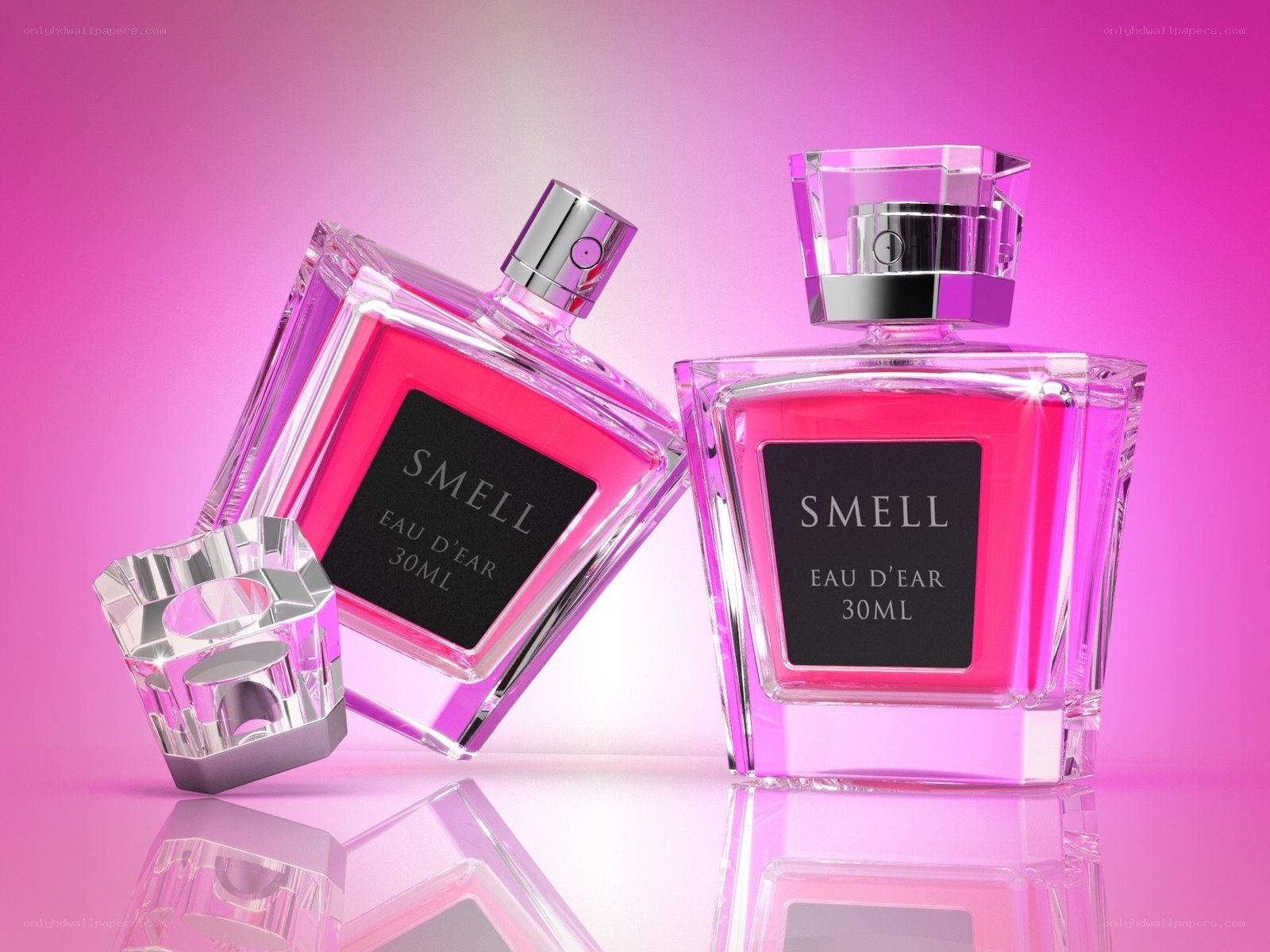 Perfume bottles on pink background