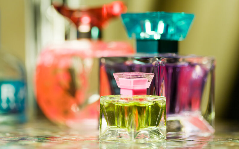 Perfume Bottles on Table — Green, Colorful