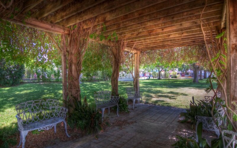 Pergola with benches in a park