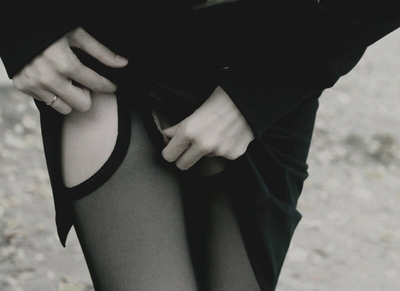 person adjusting clothing