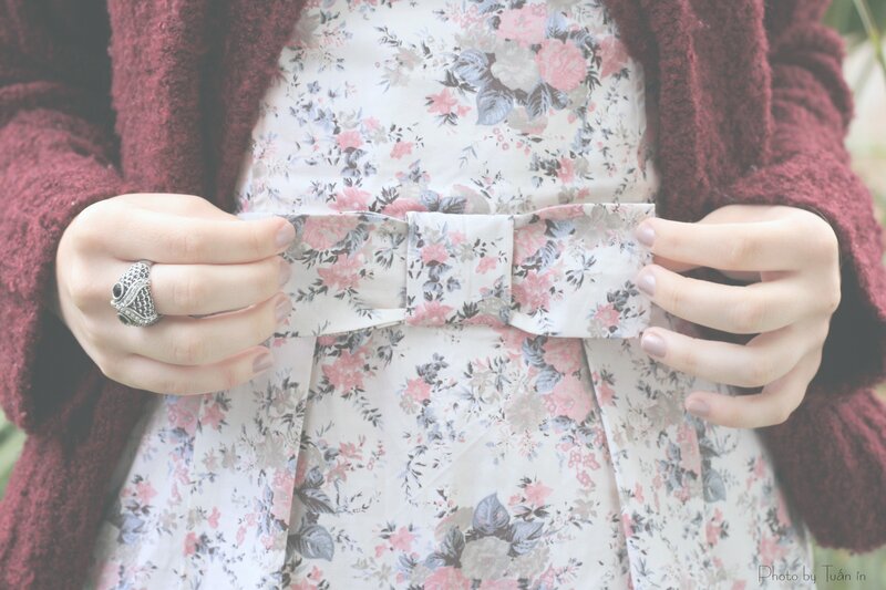 person adjusting floral dress