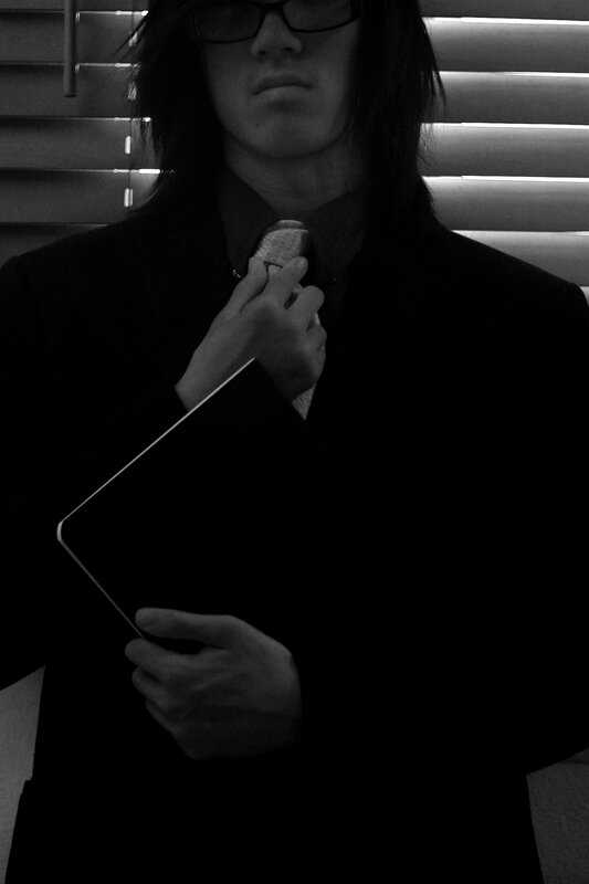 person adjusting tie in black and white