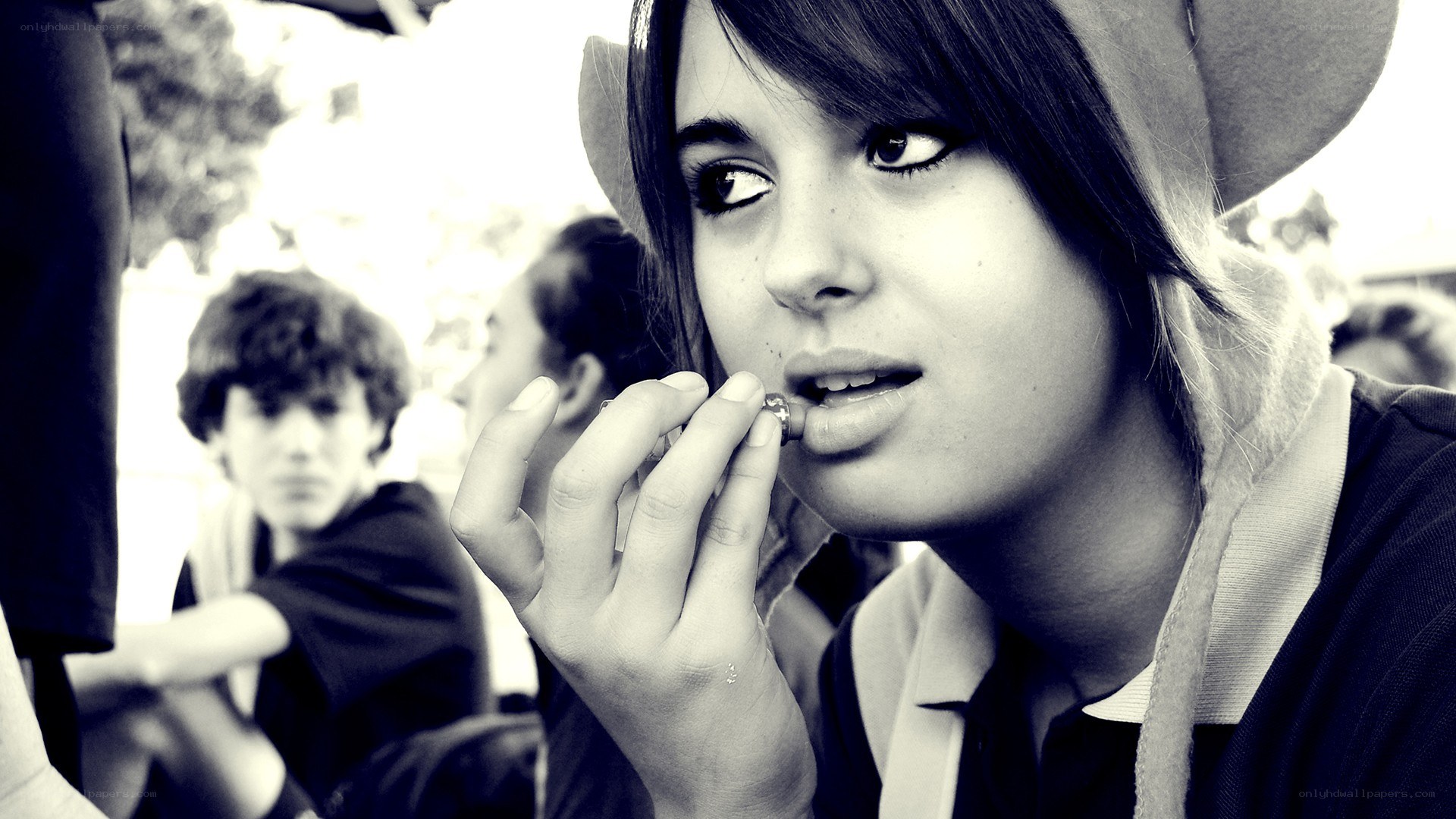person applying lip balm