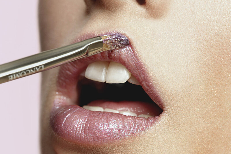 Person Applying Lip Makeup