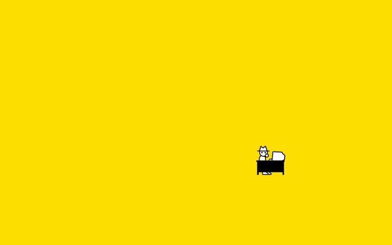 person at a desk on yellow