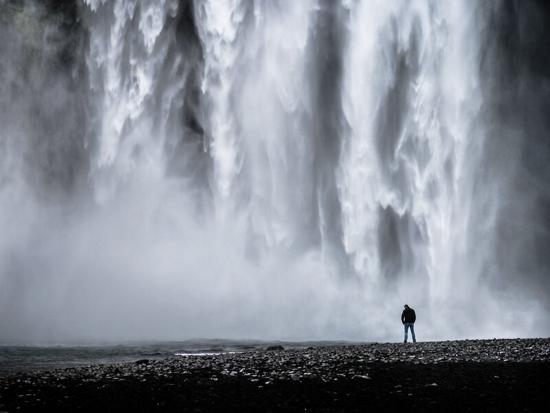 Person at a massive waterfall
