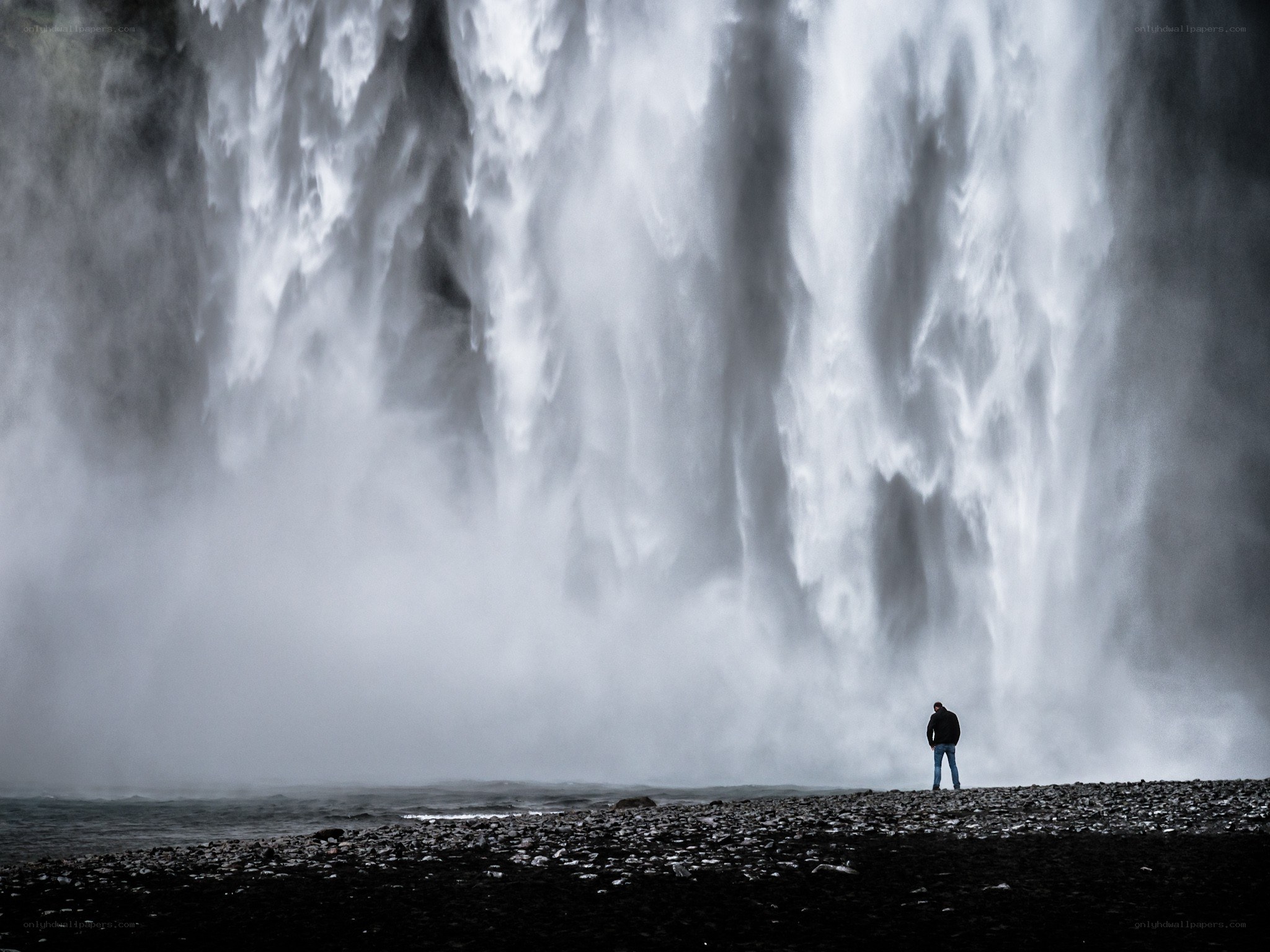 Person at a massive waterfall