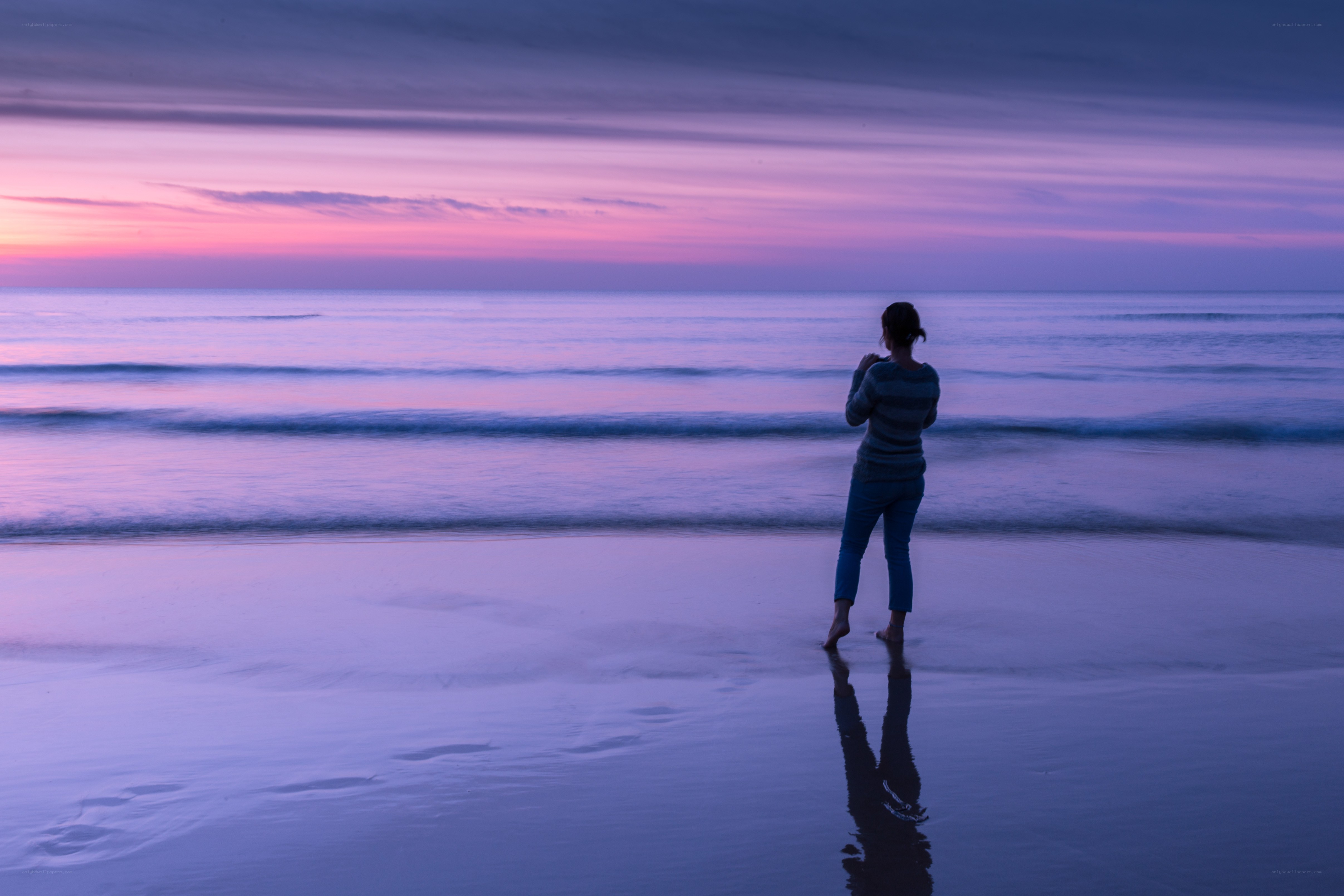 Person at beach during sunset