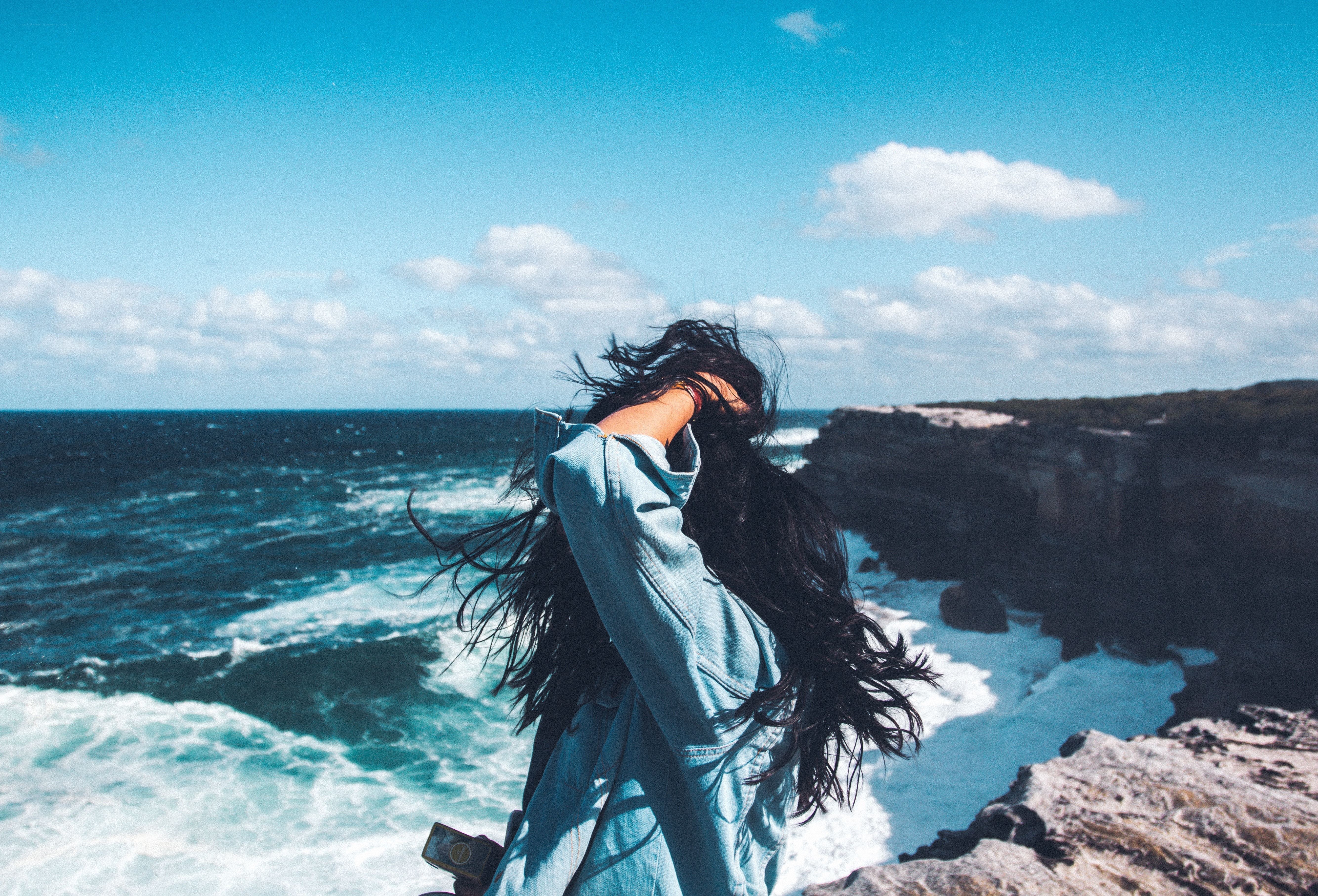Person at coastal cliff