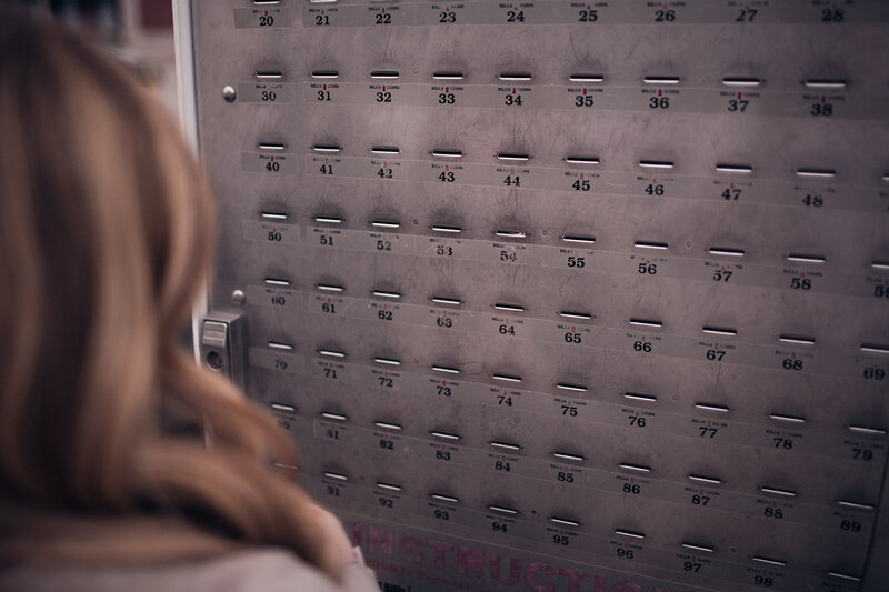 person at coin deposit machine