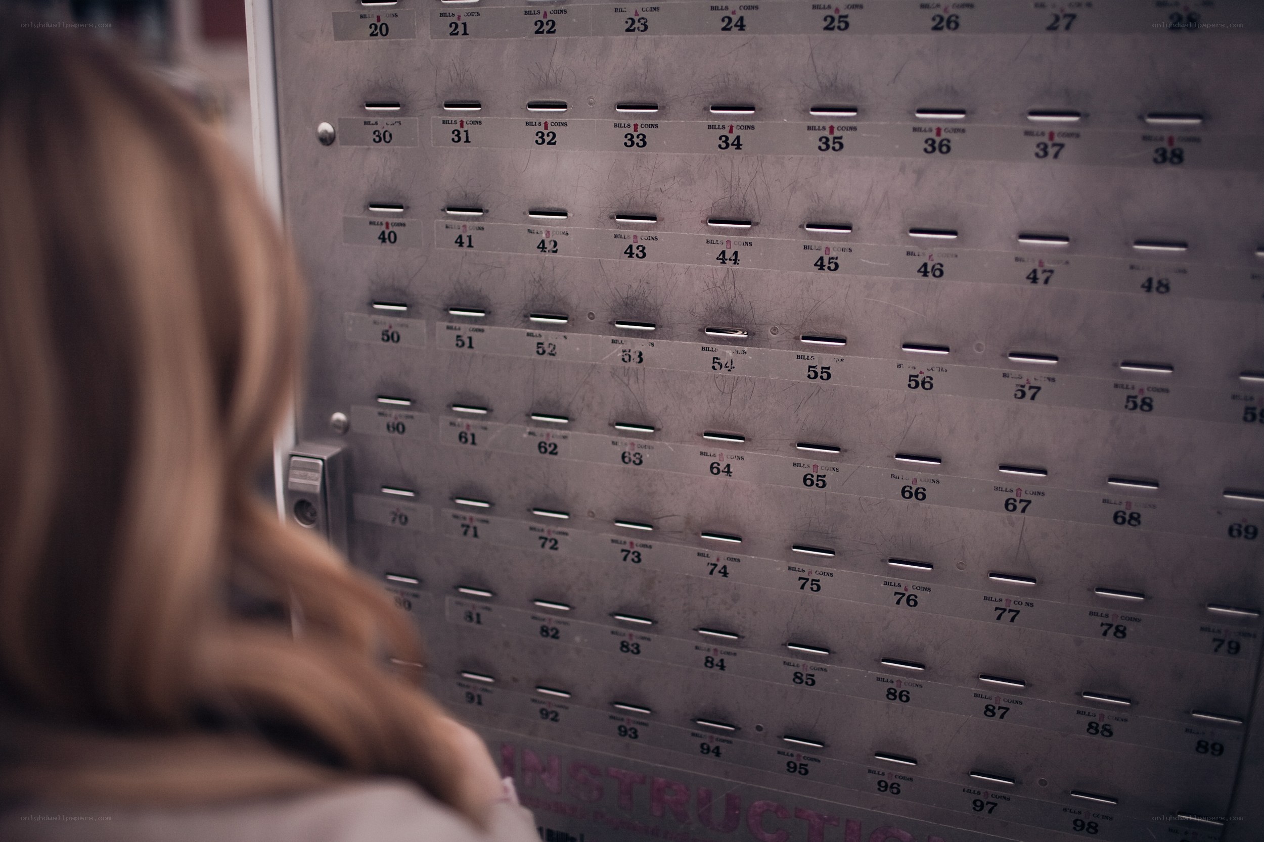 person at coin deposit machine